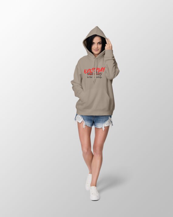 Female wearing a hoodie that says everyday is for worship